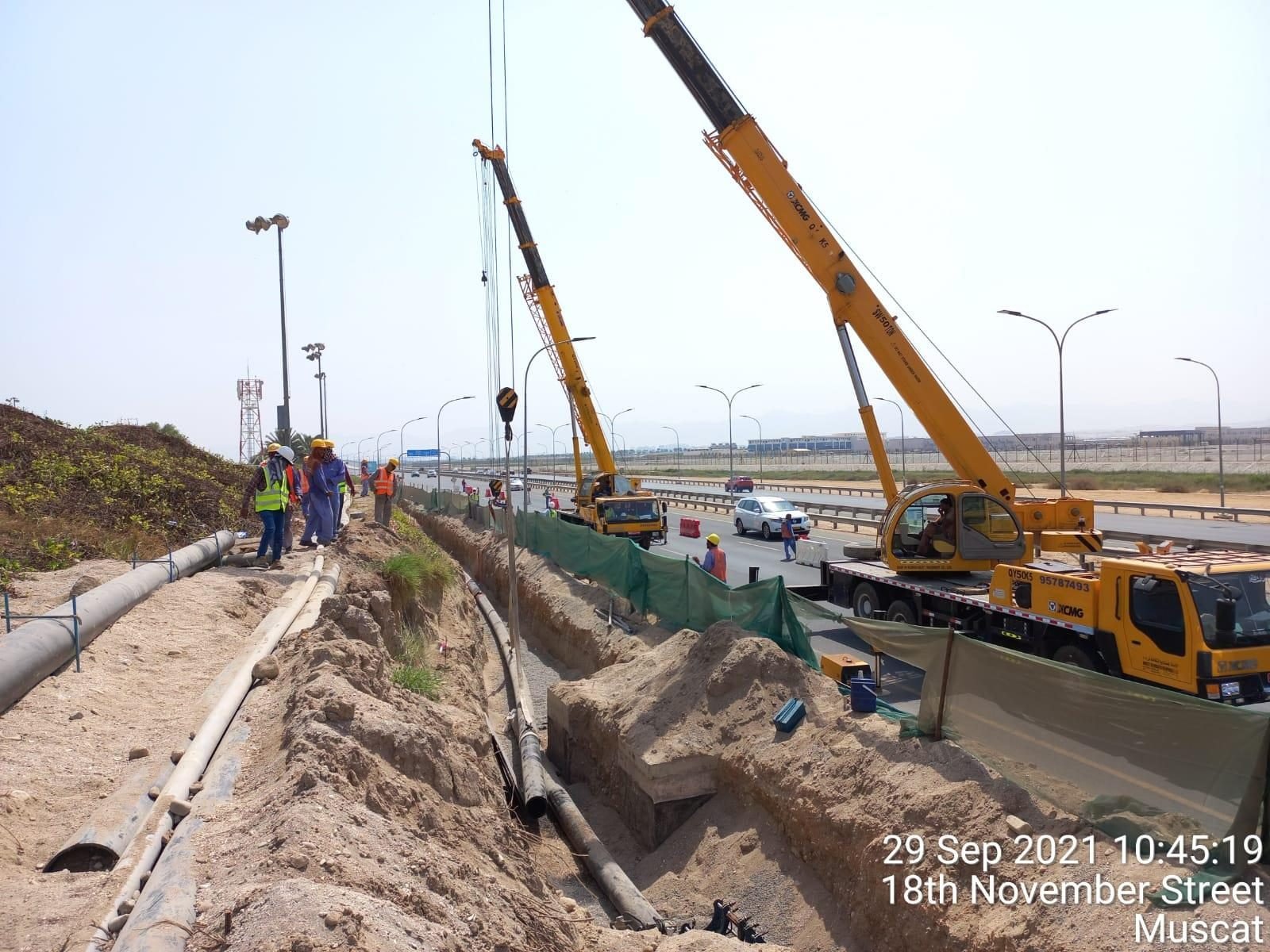 Crane lifting equipment on a road construction site